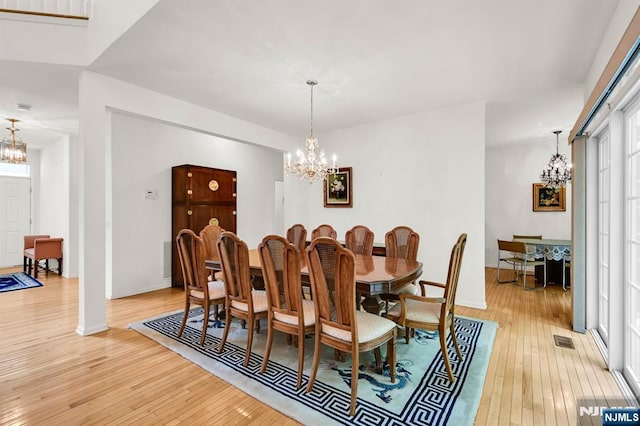 8 Pine Lake Ter Unit T008, River Vale, NJ 07675 - dining room featuring a chandelier, light wood-type flooring, and baseboards