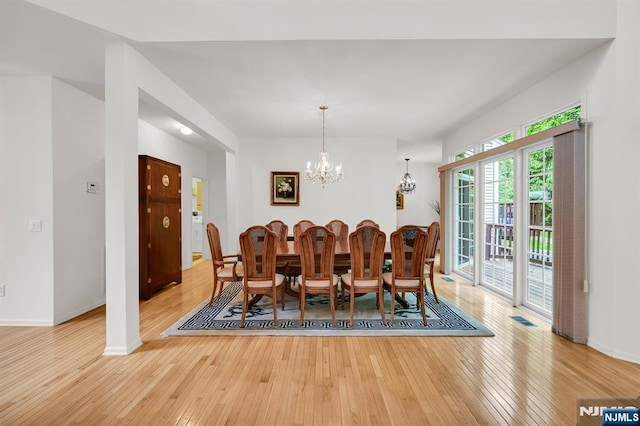 8 Pine Lake Ter Unit T008, River Vale, NJ 07675 - dining area with light wood finished floors, a chandelier, and baseboards