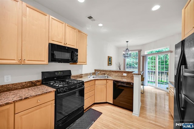 8 Pine Lake Ter Unit T008, River Vale, NJ 07675 - kitchen with black appliances, light brown cabinets, a peninsula, and recessed lighting