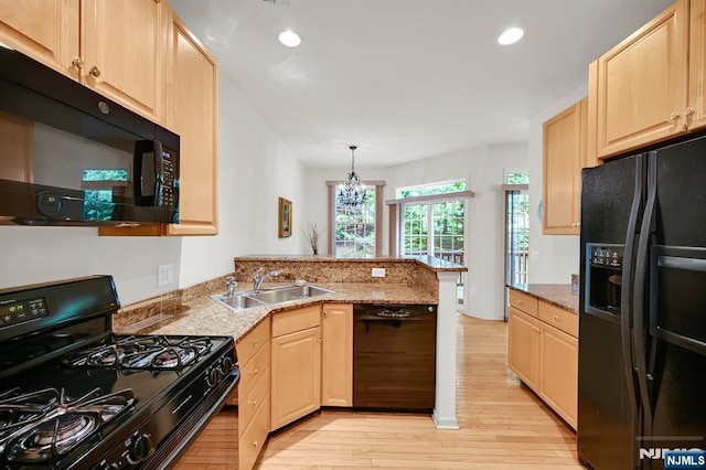 8 Pine Lake Ter Unit T008, River Vale, NJ 07675 - kitchen with black appliances, a sink, light brown cabinetry, a peninsula, and recessed lighting