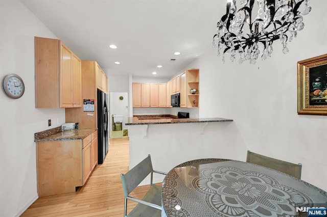 8 Pine Lake Ter Unit T008, River Vale, NJ 07675 - kitchen featuring black appliances, light brown cabinetry, light wood finished floors, dark stone countertops, and recessed lighting