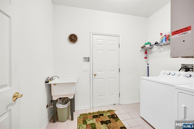 8 Pine Lake Ter Unit T008, River Vale, NJ 07675 - washroom with washer and clothes dryer, light tile patterned floors, and baseboards