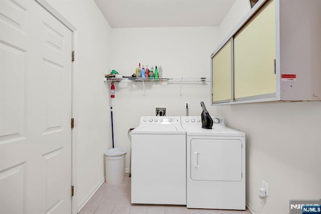 8 Pine Lake Ter Unit T008, River Vale, NJ 07675 - laundry area featuring cabinet space, washing machine and dryer, and light tile patterned floors