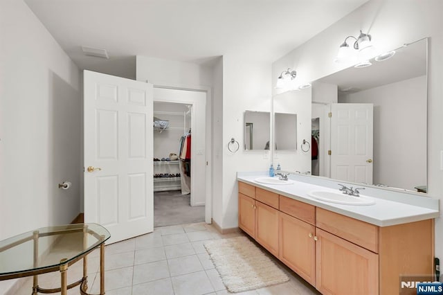 8 Pine Lake Ter Unit T008, River Vale, NJ 07675 - full bath featuring double vanity, tile patterned flooring, a walk in closet, and baseboards