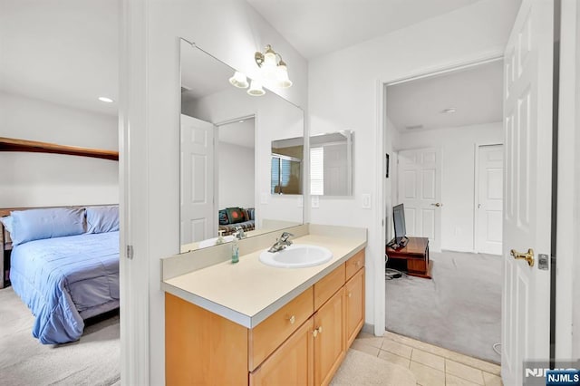 8 Pine Lake Ter Unit T008, River Vale, NJ 07675 - ensuite bathroom with vanity, tile patterned floors, and a chandelier