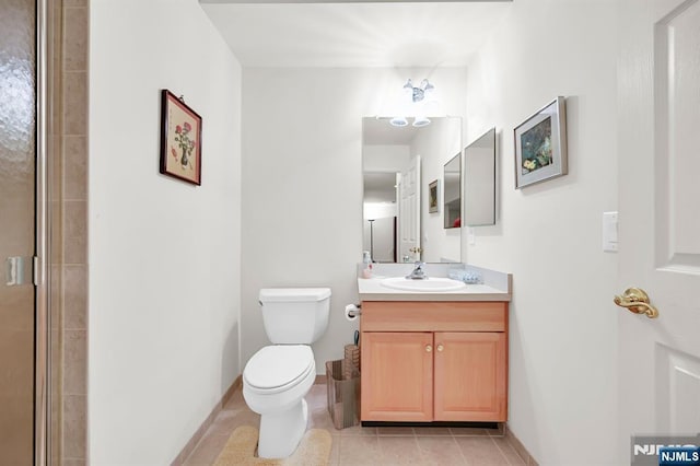 8 Pine Lake Ter Unit T008, River Vale, NJ 07675 - bathroom with vanity, tile patterned floors, toilet, and a shower with door