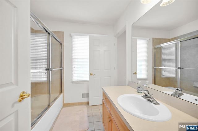 8 Pine Lake Ter Unit T008, River Vale, NJ 07675 - bathroom featuring tile patterned floors, vanity, plenty of natural light, and enclosed tub / shower combo