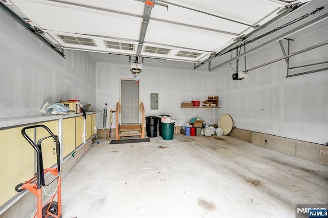 8 Pine Lake Ter Unit T008, River Vale, NJ 07675 - garage featuring a garage door opener and electric panel