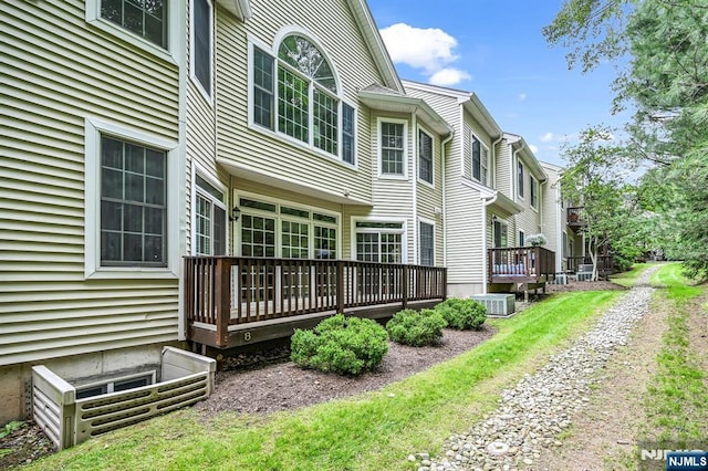 8 Pine Lake Ter Unit T008, River Vale, NJ 07675 - view of home's exterior with a wooden deck, central AC unit, and a residential view