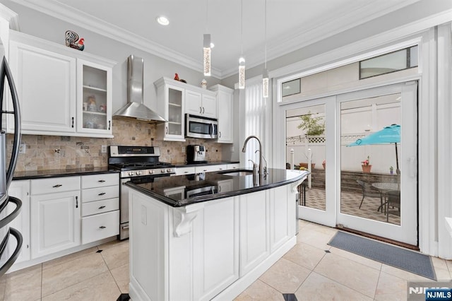 52 Myrtle Ave Unit B, Edgewater, NJ 07020 - kitchen with wall chimney exhaust hood, appliances with stainless steel finishes, a sink, decorative backsplash, and light tile patterned flooring