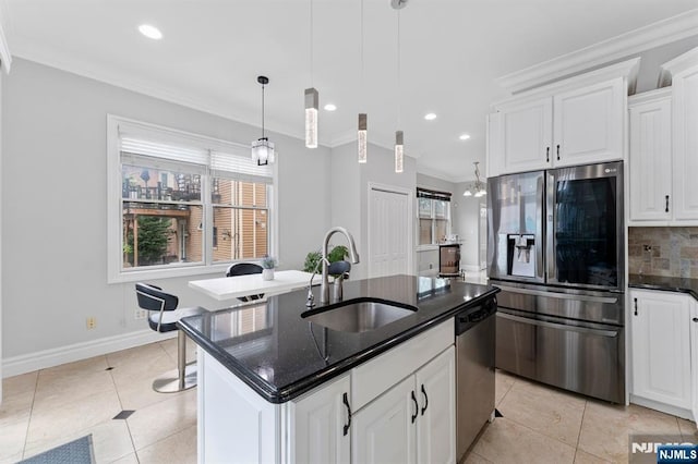 52 Myrtle Ave Unit B, Edgewater, NJ 07020 - kitchen with appliances with stainless steel finishes, a sink, crown molding, decorative backsplash, and plenty of natural light