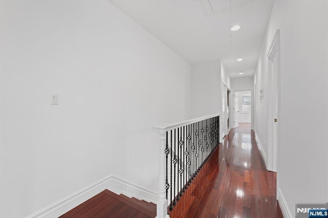 52 Myrtle Ave Unit B, Edgewater, NJ 07020 - corridor with attic access, hardwood / wood-style flooring, baseboards, an upstairs landing, and recessed lighting