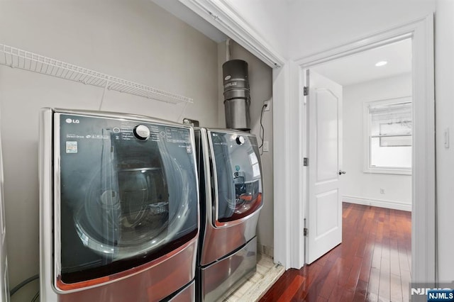 52 Myrtle Ave Unit B, Edgewater, NJ 07020 - laundry area with washing machine and clothes dryer, hardwood / wood-style floors, and baseboards