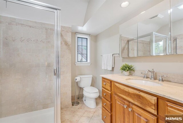 173 Sheridan Ave, Ho-Ho-Kus, NJ 07423 - full bath with vanity, a stall shower, toilet, and tile patterned floors