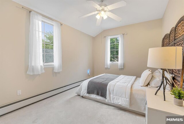 173 Sheridan Ave, Ho-Ho-Kus, NJ 07423 - carpeted bedroom with vaulted ceiling, a baseboard heating unit, and a ceiling fan