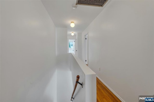 2410 3rd St, Fort Lee, NJ 07024 - hall featuring an upstairs landing, light wood-style flooring, and baseboards