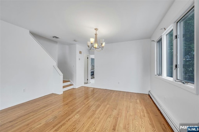 2410 3rd St, Fort Lee, NJ 07024 - empty room featuring a chandelier, light wood finished floors, stairway, a baseboard heating unit, and baseboards