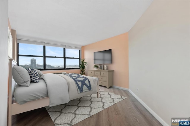7004 E Kennedy Blvd Unit 28C, Guttenberg, NJ 07093 - bedroom featuring light wood-type flooring and baseboards