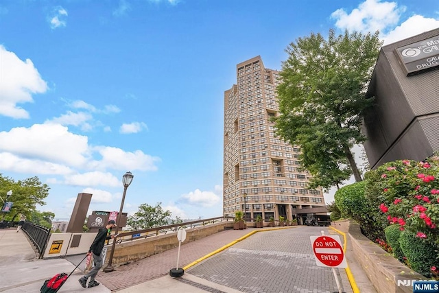 7004 E Kennedy Blvd Unit 28C, Guttenberg, NJ 07093 - view of decorative road with traffic signs, street lighting, and curbs