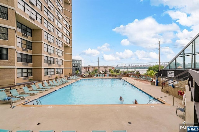 7004 E Kennedy Blvd Unit 28C, Guttenberg, NJ 07093 - community pool with a patio area