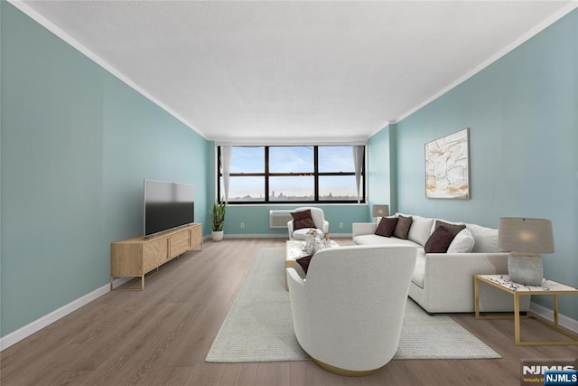 7004 E Kennedy Blvd Unit 28C, Guttenberg, NJ 07093 - living room featuring crown molding, wood finished floors, and baseboards
