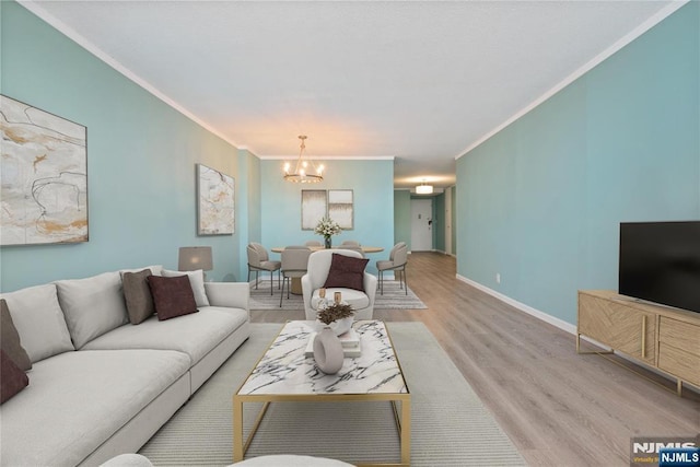7004 E Kennedy Blvd Unit 28C, Guttenberg, NJ 07093 - living area with a chandelier, crown molding, light wood-style floors, and baseboards