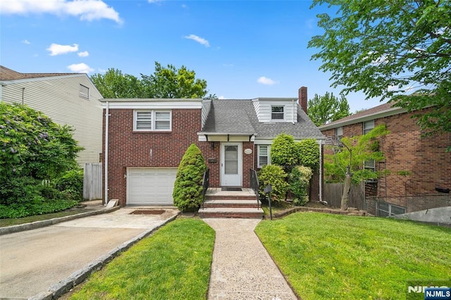 344 Northwood Way, Palisades Park, NJ 07650 - view of front of house featuring driveway, a garage, a chimney, a front lawn, and brick siding