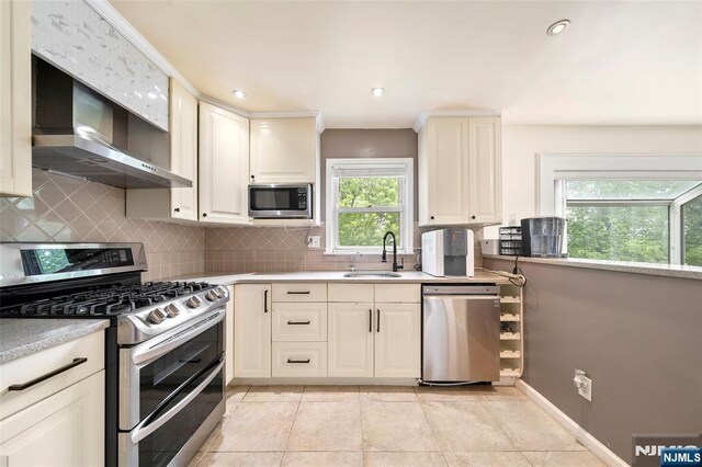 344 Northwood Way, Palisades Park, NJ 07650 - kitchen featuring appliances with stainless steel finishes, a sink, tasteful backsplash, light countertops, and recessed lighting