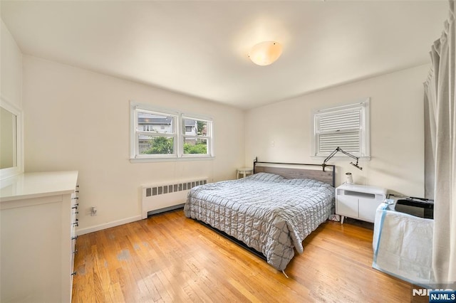 344 Northwood Way, Palisades Park, NJ 07650 - bedroom featuring radiator, light wood-style floors, and baseboards