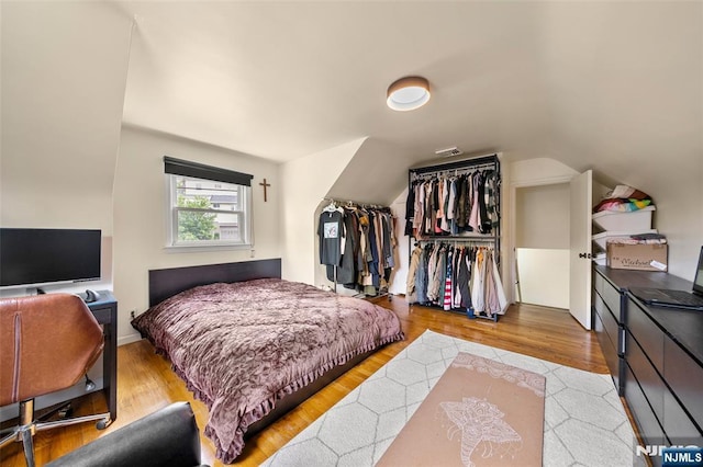 344 Northwood Way, Palisades Park, NJ 07650 - bedroom with wood finished floors, vaulted ceiling, and a closet