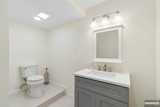 45 Longridge Rd, Montvale, NJ 07645 - half bathroom with vanity, toilet, baseboards, and tile patterned floors