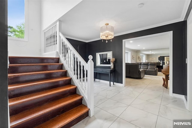 45 Longridge Rd, Montvale, NJ 07645 - stairway featuring marble look tile flooring, a chandelier, ornamental molding, and baseboards