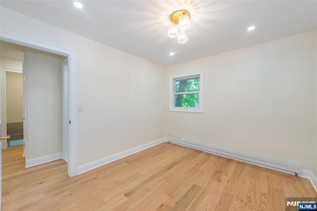 112 Fern St, Twp Of Washington, NJ 07676 - spare room with baseboard heating, light wood-type flooring, baseboards, and recessed lighting
