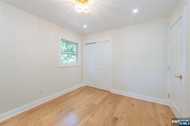 112 Fern St, Twp Of Washington, NJ 07676 - unfurnished bedroom featuring light wood-type flooring, baseboards, a closet, recessed lighting, and a chandelier