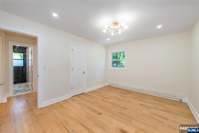 112 Fern St, Twp Of Washington, NJ 07676 - empty room featuring baseboard heating, light wood-type flooring, a chandelier, baseboards, and recessed lighting