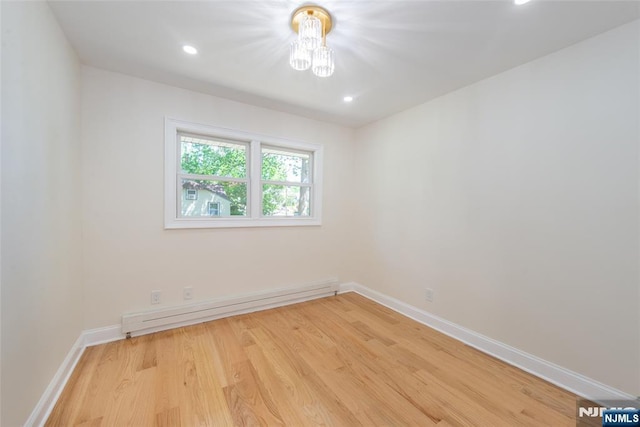 112 Fern St, Twp Of Washington, NJ 07676 - unfurnished room featuring a chandelier, a baseboard heating unit, light wood finished floors, baseboards, and recessed lighting