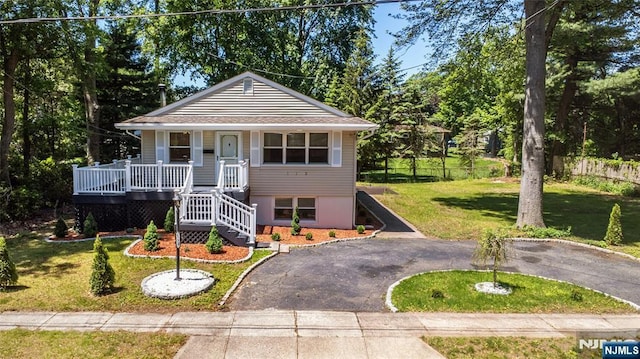 112 Fern St, Twp Of Washington, NJ 07676 - view of front of house featuring stairway, a porch, and asphalt driveway