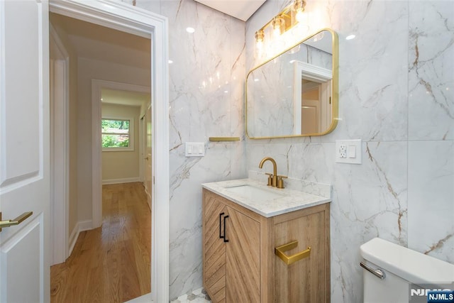 112 Fern St, Twp Of Washington, NJ 07676 - bathroom featuring vanity, toilet, tile walls, and wood finished floors