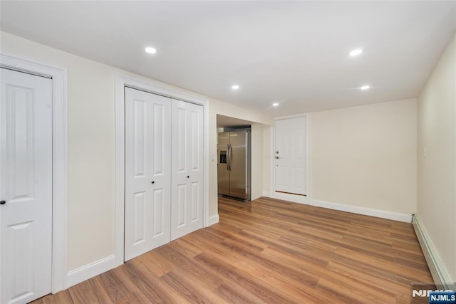 112 Fern St, Twp Of Washington, NJ 07676 - unfurnished bedroom with stainless steel fridge with ice dispenser, light wood-style floors, baseboards, and recessed lighting