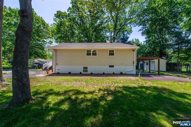 112 Fern St, Twp Of Washington, NJ 07676 - view of front of home with a front yard, a carport, and asphalt driveway