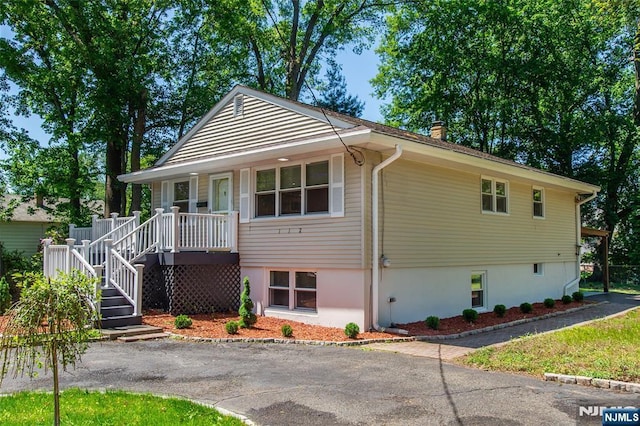 112 Fern St, Twp Of Washington, NJ 07676 - view of front of home with a chimney and covered porch