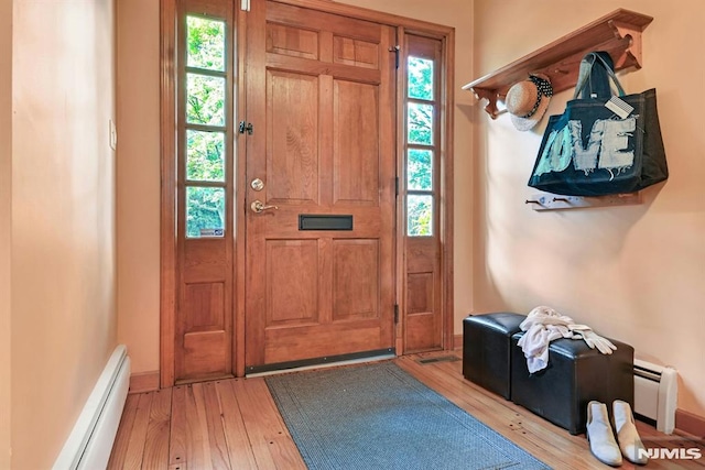 68 Birch St, Ramsey, NJ 07446 - entrance foyer with a baseboard radiator, light wood finished floors, and baseboards