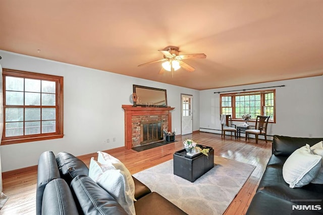 68 Birch St, Ramsey, NJ 07446 - living area with a ceiling fan, wood finished floors, a brick fireplace, and baseboards