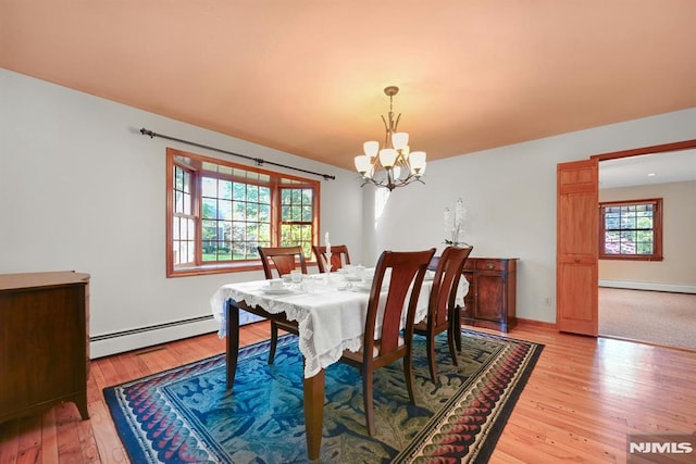 68 Birch St, Ramsey, NJ 07446 - dining room with a baseboard radiator, a chandelier, light wood-type flooring, and baseboards