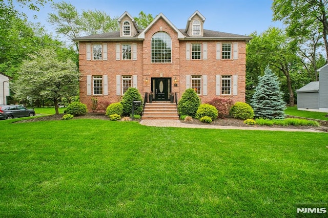71 Louville Ave, Park Ridge, NJ 07656 - view of front of house featuring a front lawn and brick siding