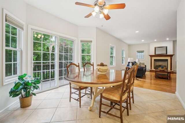 71 Louville Ave, Park Ridge, NJ 07656 - dining room featuring light tile patterned flooring, a fireplace, recessed lighting, ceiling fan, and baseboards