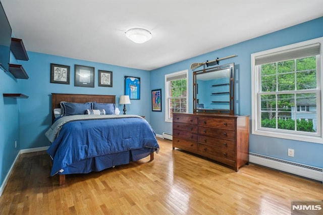 71 Louville Ave, Park Ridge, NJ 07656 - bedroom featuring wood finished floors, baseboards, and a baseboard heating unit