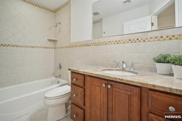 71 Louville Ave, Park Ridge, NJ 07656 - full bathroom with vanity, toilet, tub / shower combination, tile walls, and tile patterned flooring