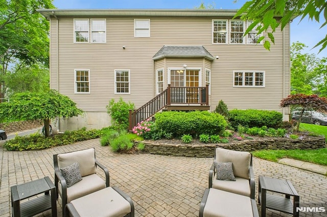 71 Louville Ave, Park Ridge, NJ 07656 - back of property with an outdoor hangout area and a patio