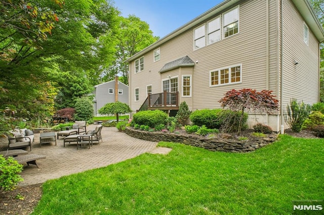 71 Louville Ave, Park Ridge, NJ 07656 - rear view of property with a yard, a patio, an outdoor living space, and a wooden deck